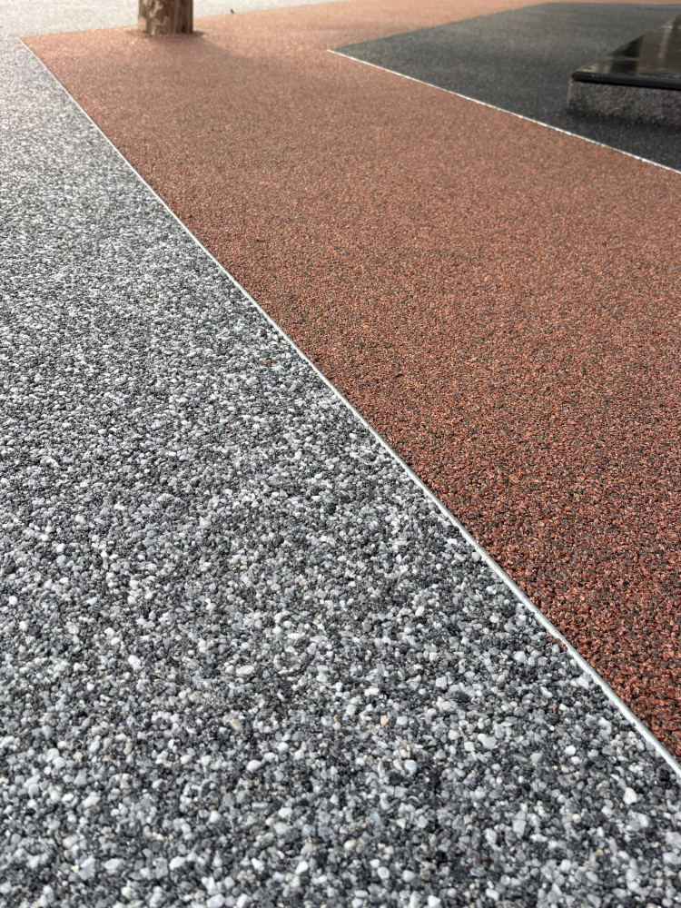 Finished resin-bound paving surrounding garden beds