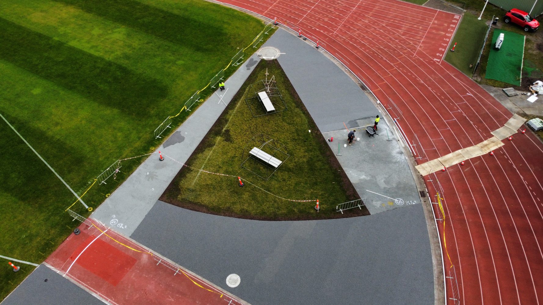 Aerial view of StoneSet permeable paving being installed on an athletics track infield